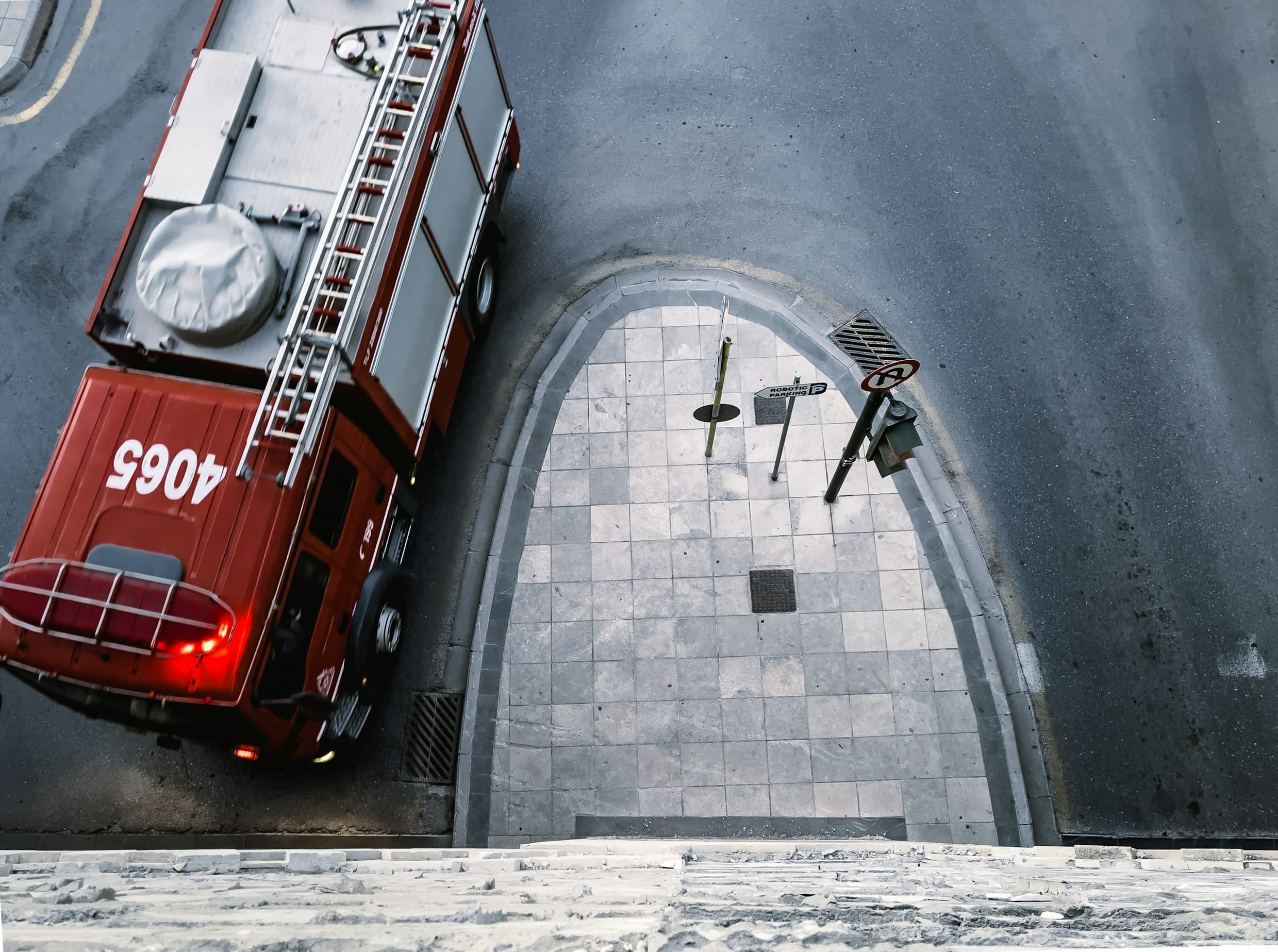 Aerial view of fire apparatus staged outside a fire station